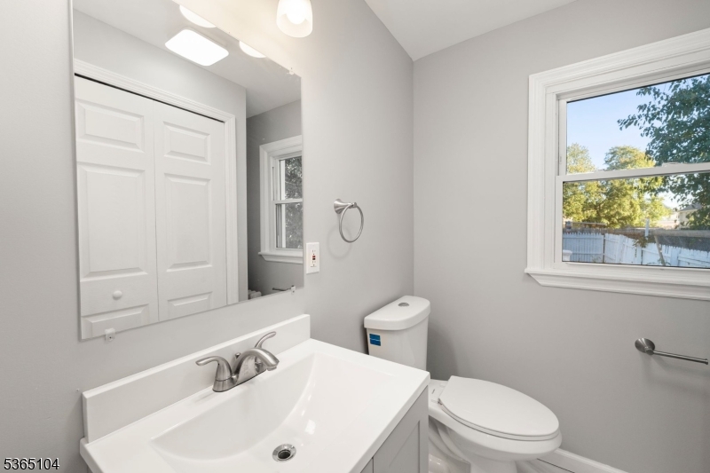 829 South 2nd Street Plainfield, NJ 07063 - Photo 10 of 23 a bathroom with a sink a toilet and a mirror