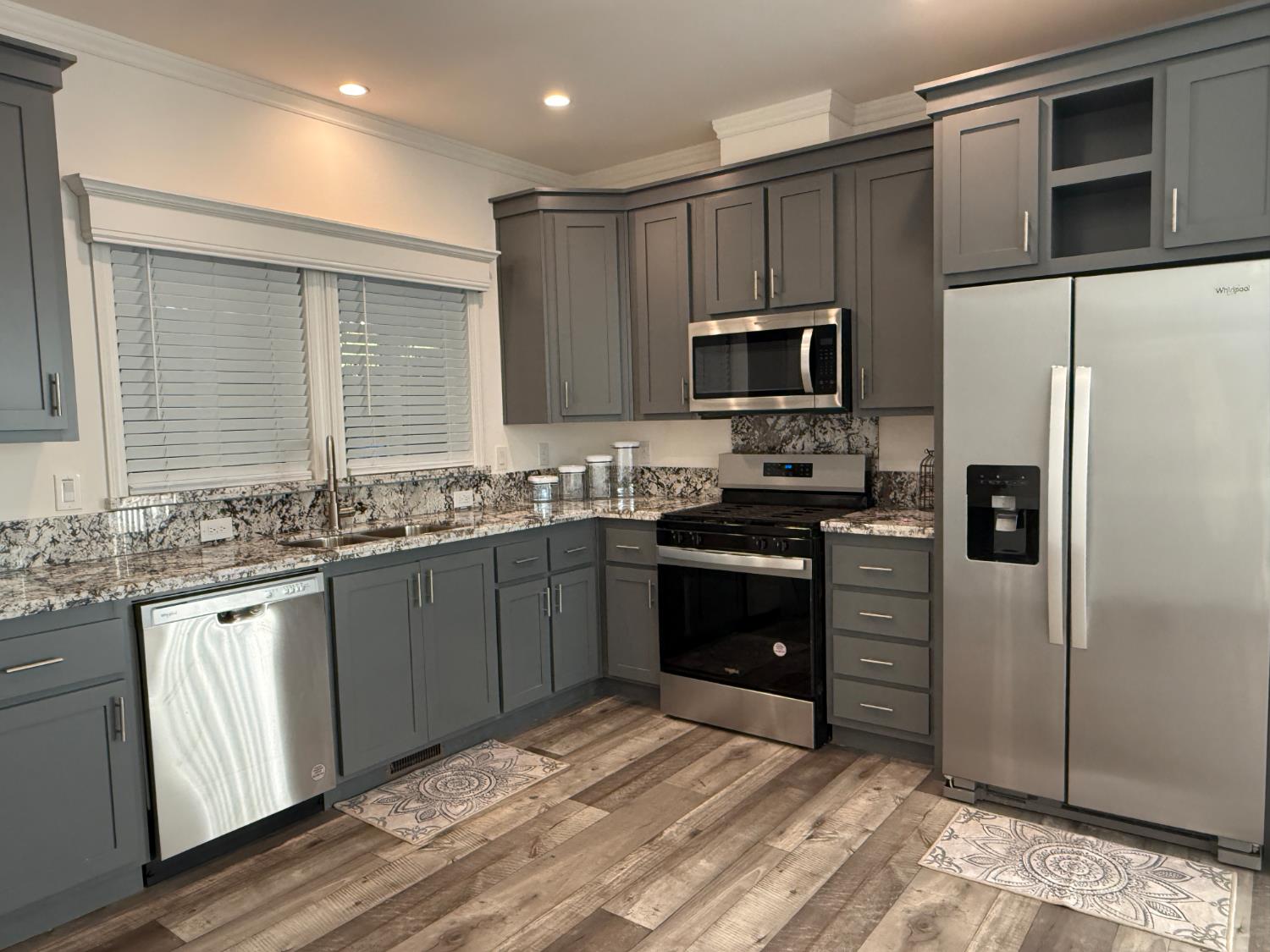 6048 Declaration Circle Citrus Heights, CA 95621 - Photo 2 of 28 a kitchen with granite countertop a refrigerator stove and microwave