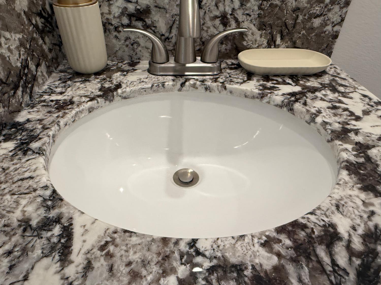 6048 Declaration Circle Citrus Heights, CA 95621 - Photo 21 of 28 a bathroom with a sink and a mirror