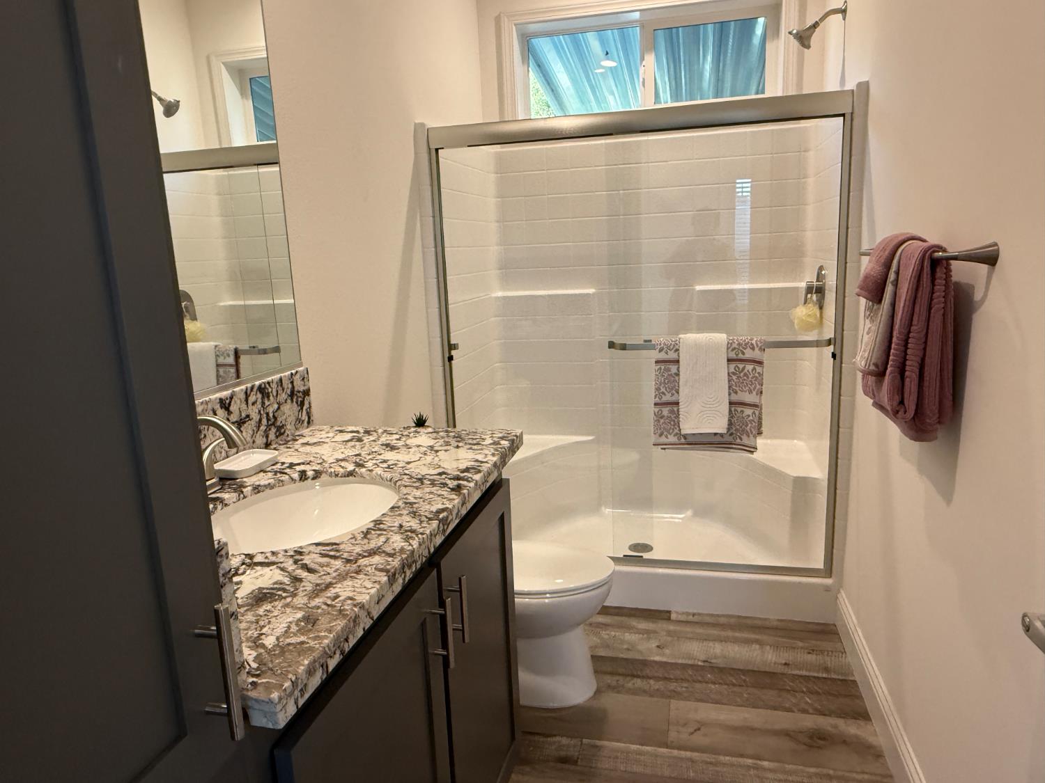 6048 Declaration Circle Citrus Heights, CA 95621 - Photo 3 of 28 a bathroom with a granite countertop sink toilet and shower