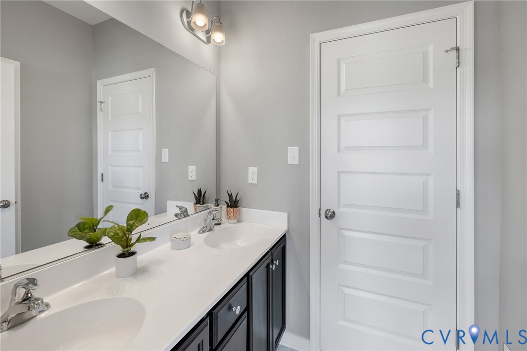 4122 Ebbies Crossing Midlothian, VA 23112 - Photo 22 of 47 a bathroom with a sink vanity and a mirror