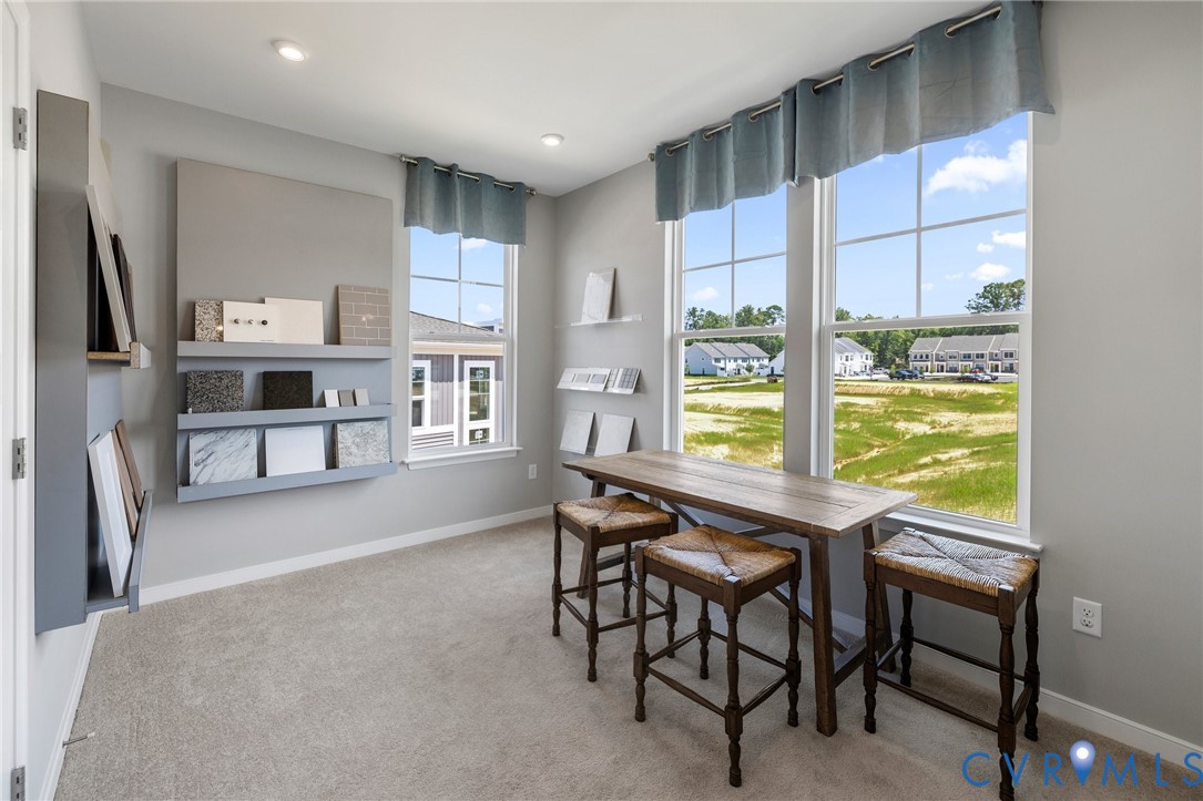 4122 Ebbies Crossing Midlothian, VA 23112 - Photo 23 of 47 a dining room with furniture and a floor to ceiling window