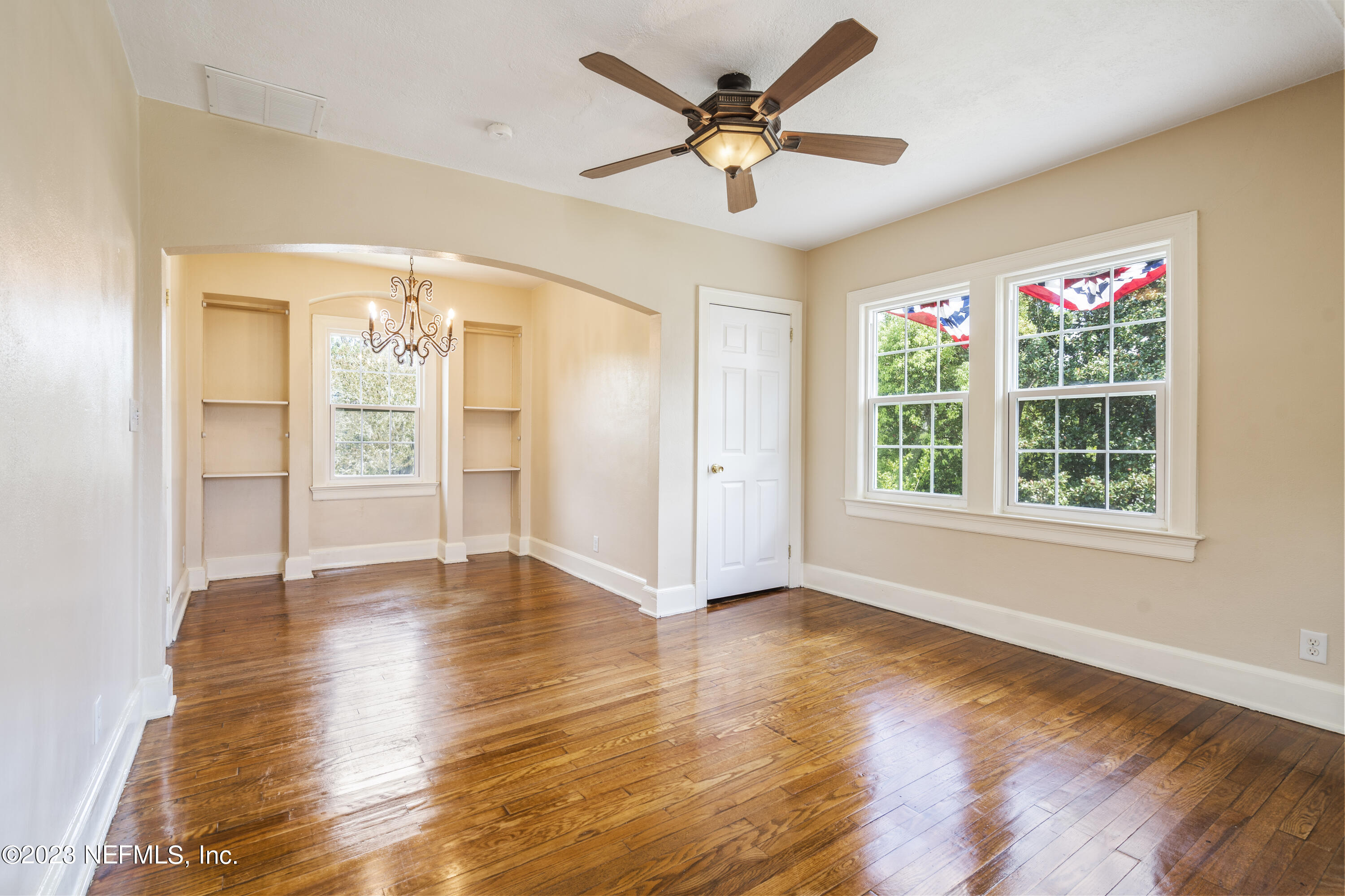 3993 Spring Park Road Jacksonville, FL 32207 - Photo 35 of 41 a view of an empty room with a window and wooden floor