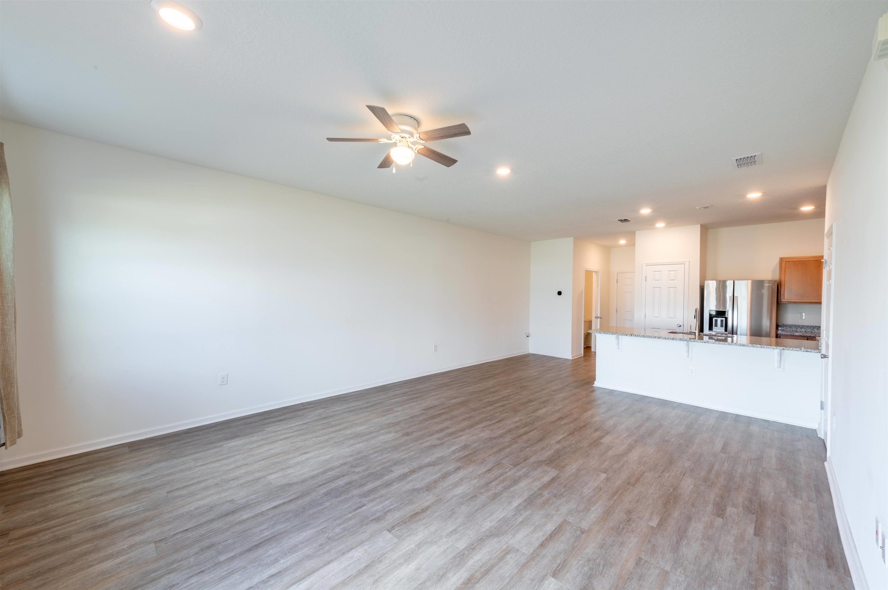 48 Mustard Hill St. Augustine, FL 32086 - Photo 13 of 28 a view of an empty room with wooden floor