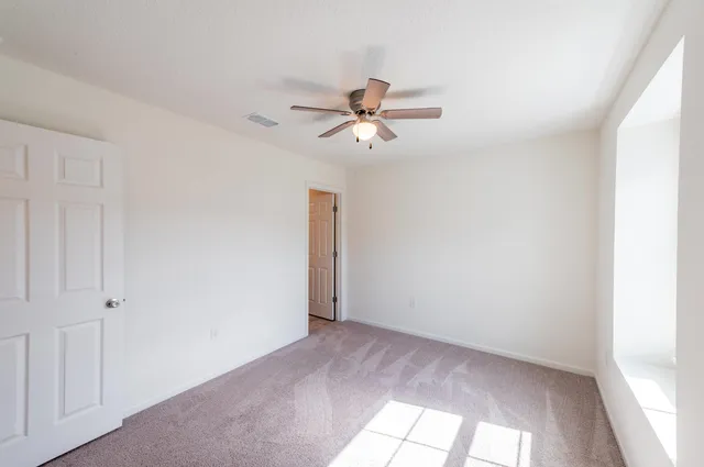 a view of a ceiling fan in a room