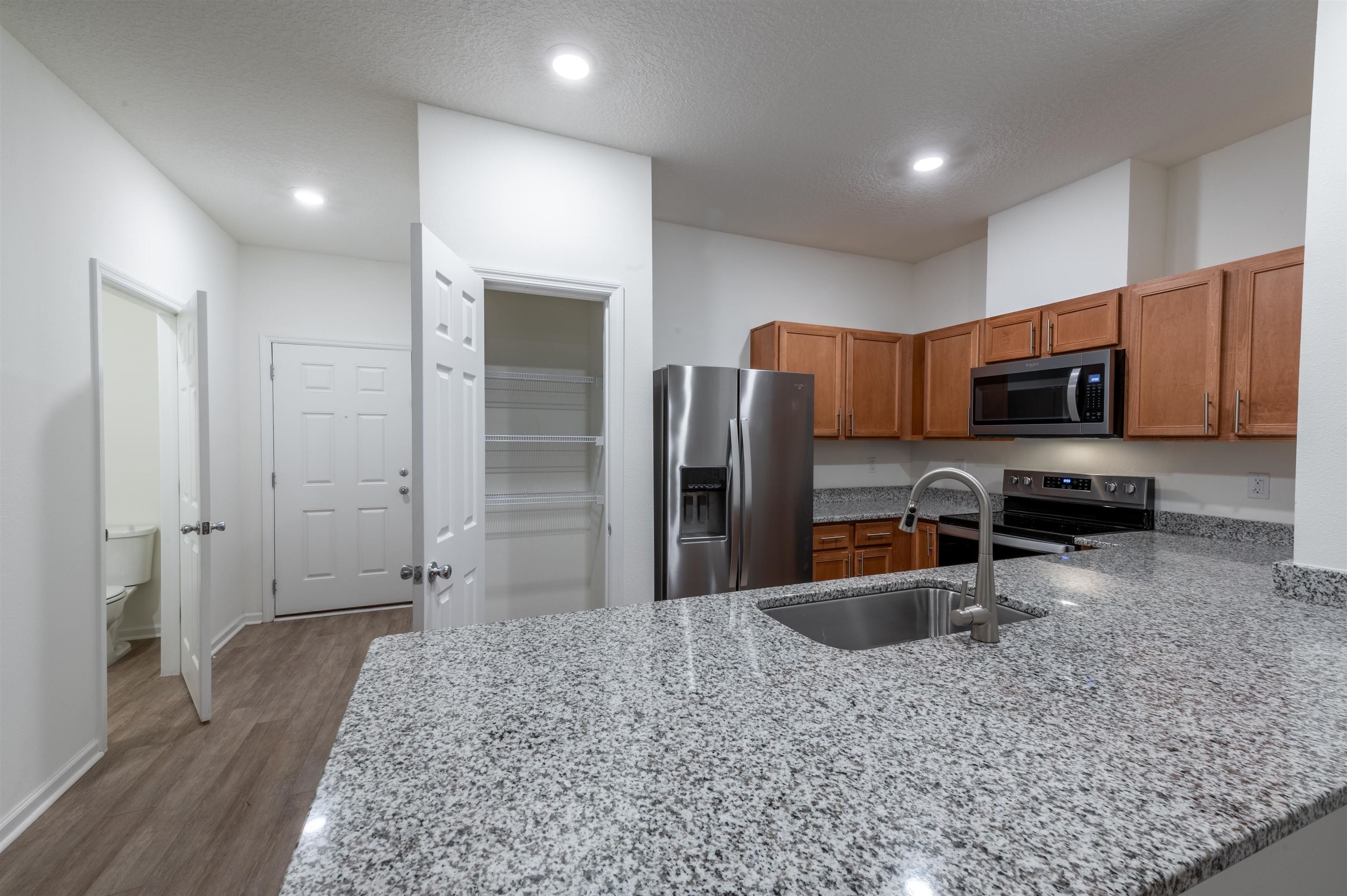 48 Mustard Hill St. Augustine, FL 32086 - Photo 28 of 28 a kitchen with stainless steel appliances granite countertop a refrigerator a stove and a sink