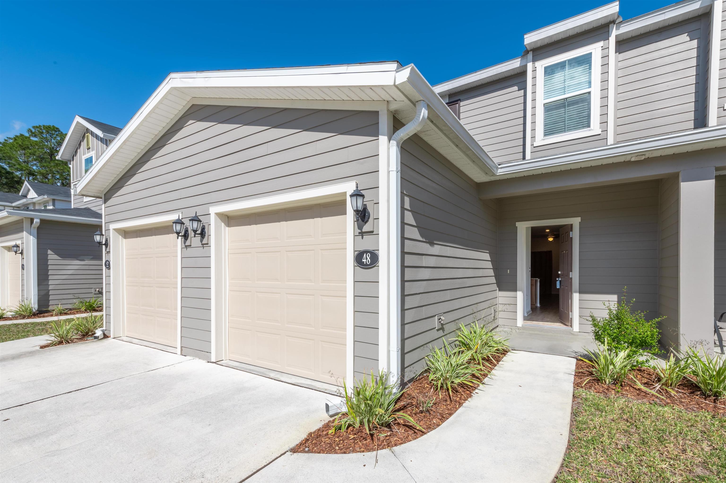 48 Mustard Hill St. Augustine, FL 32086 - Photo 3 of 28 a front view of a house with a yard