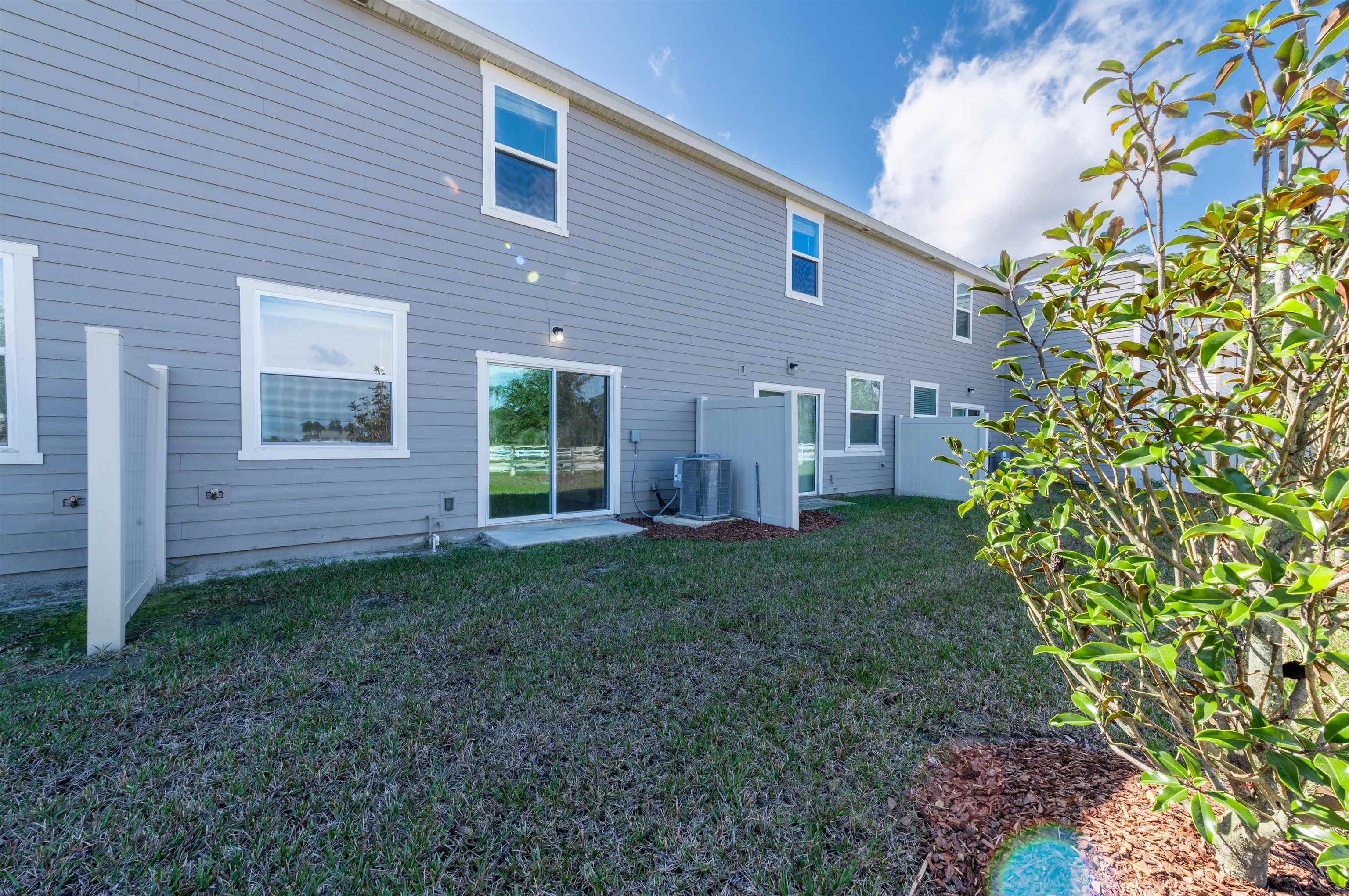 48 Mustard Hill St. Augustine, FL 32086 - Photo 5 of 28 a view of a house with a back yard