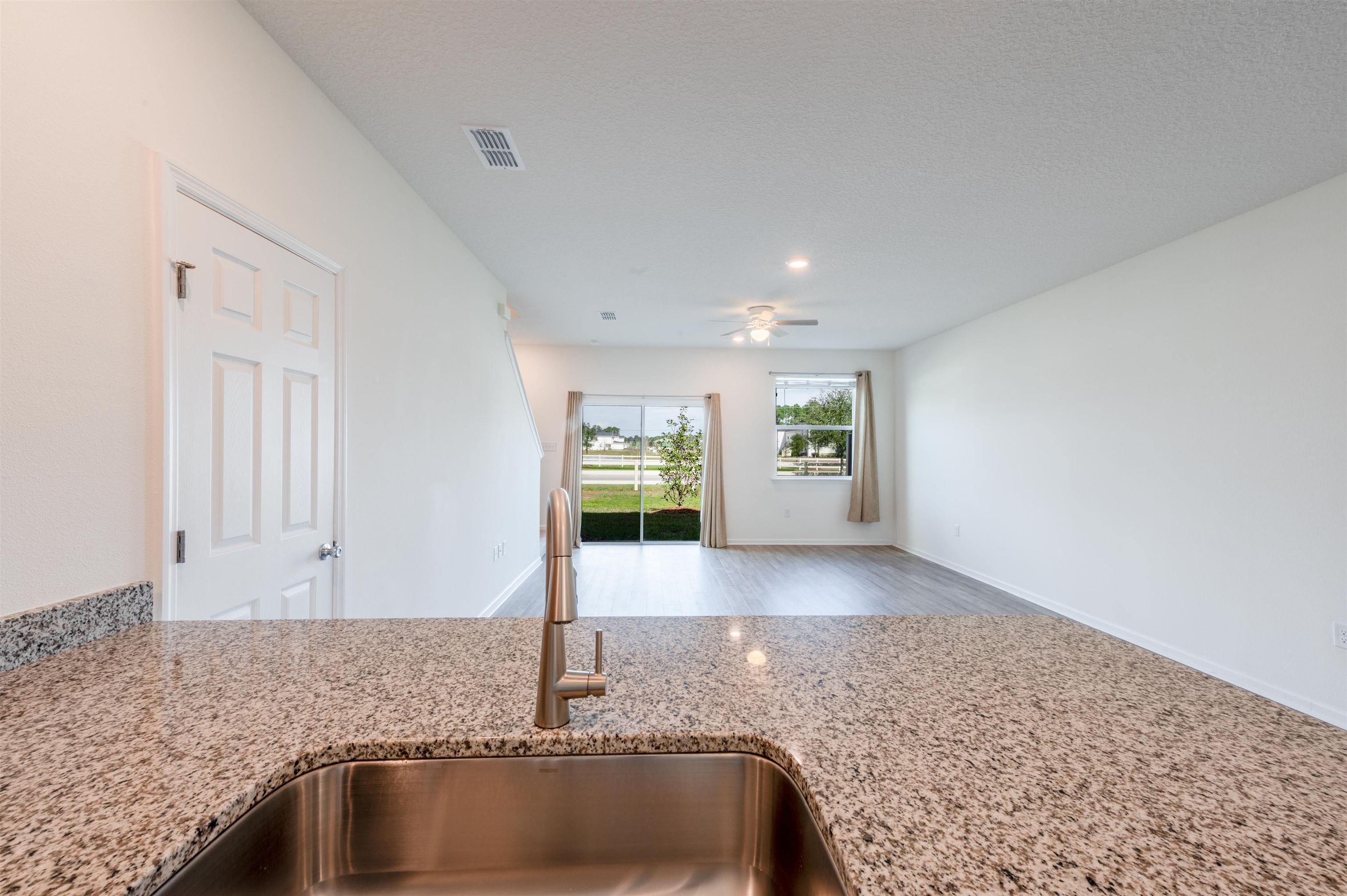 48 Mustard Hill St. Augustine, FL 32086 - Photo 10 of 28 a view of a kitchen with a sink and dishwasher