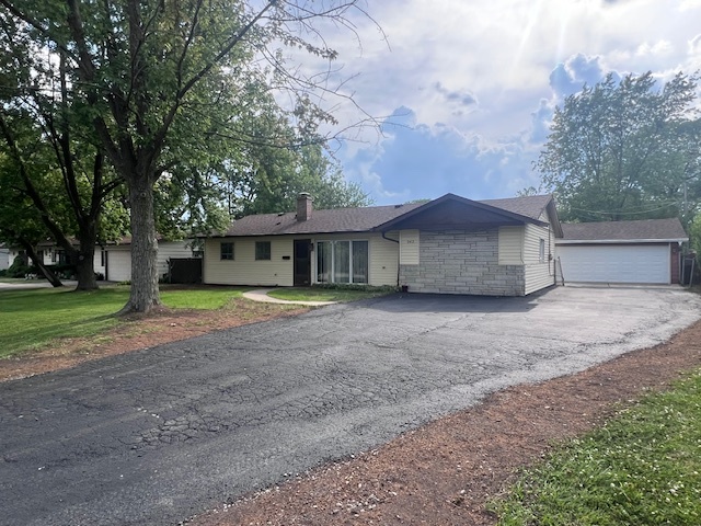342 Greenwood Road Glenview, IL 60025 - Photo 2 of 11 a view of a house with a yard and large tree