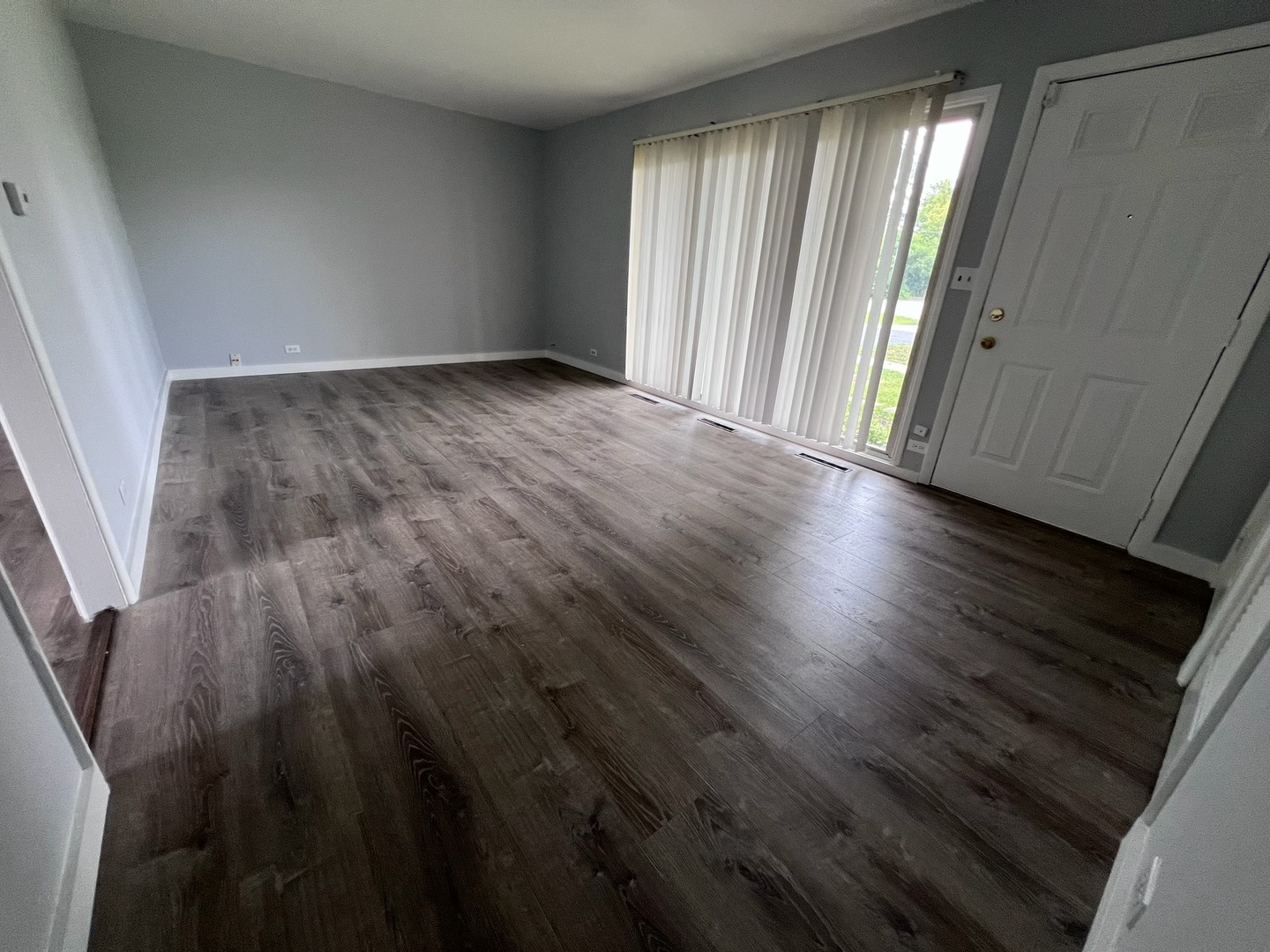 342 Greenwood Road Glenview, IL 60025 - Photo 3 of 11 an empty room with wooden floor and windows