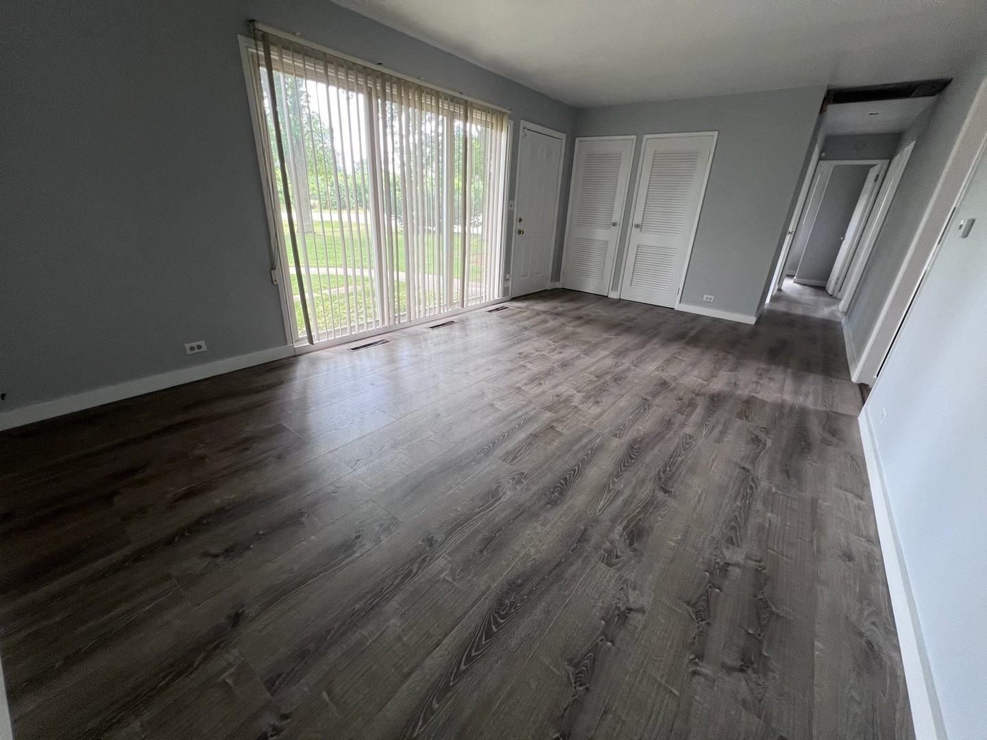 342 Greenwood Road Glenview, IL 60025 - Photo 4 of 11 a view of an empty room with wooden floor and a window