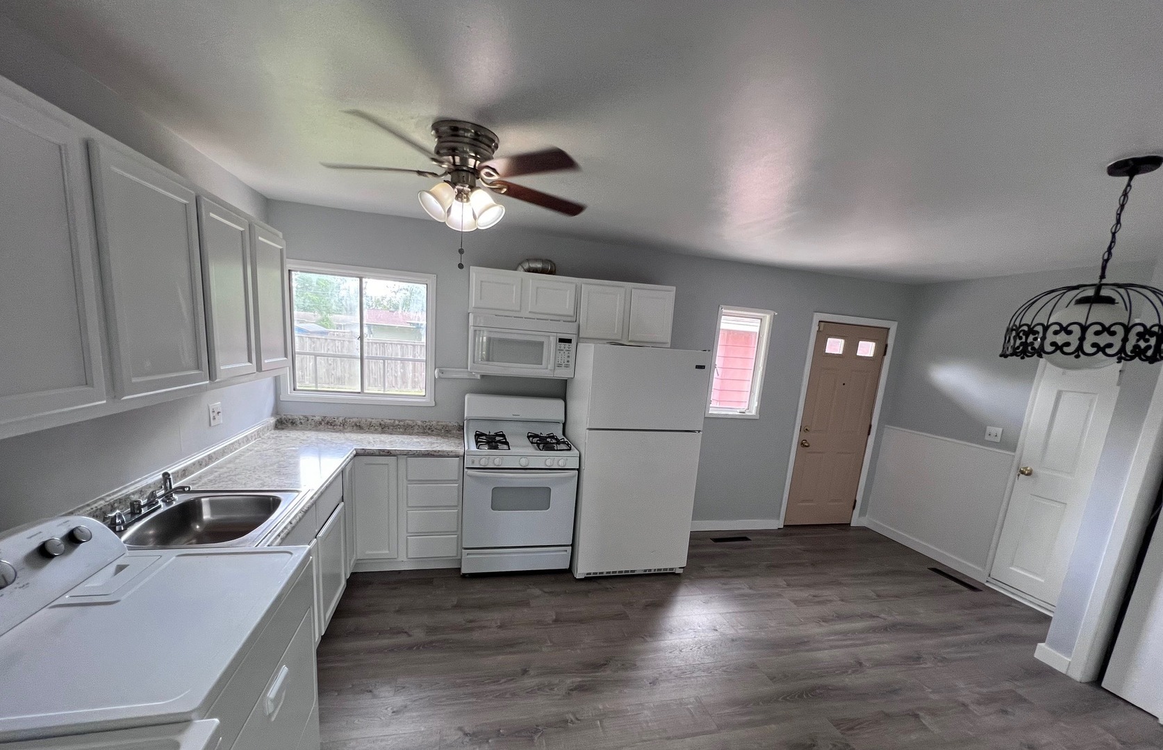 342 Greenwood Road Glenview, IL 60025 - Photo 5 of 11 a kitchen with white cabinets and appliances