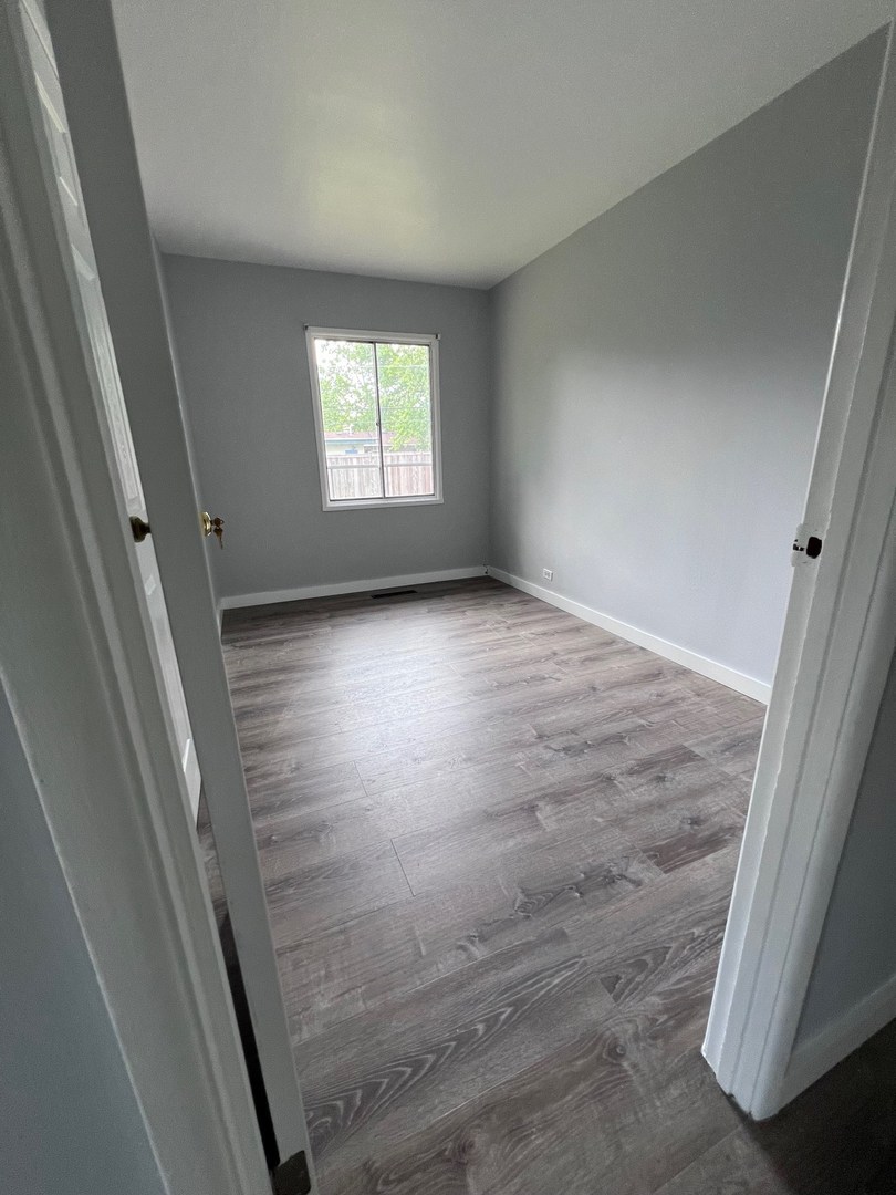 342 Greenwood Road Glenview, IL 60025 - Photo 9 of 11 an empty room with windows