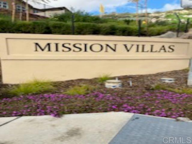 a view of outdoor space with signage and flags