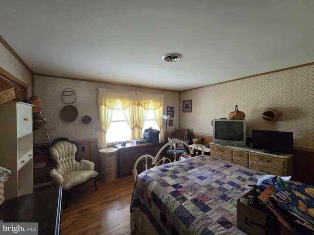 a bed room with a bed and a window