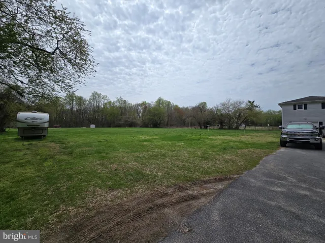 a view of a garden with houses