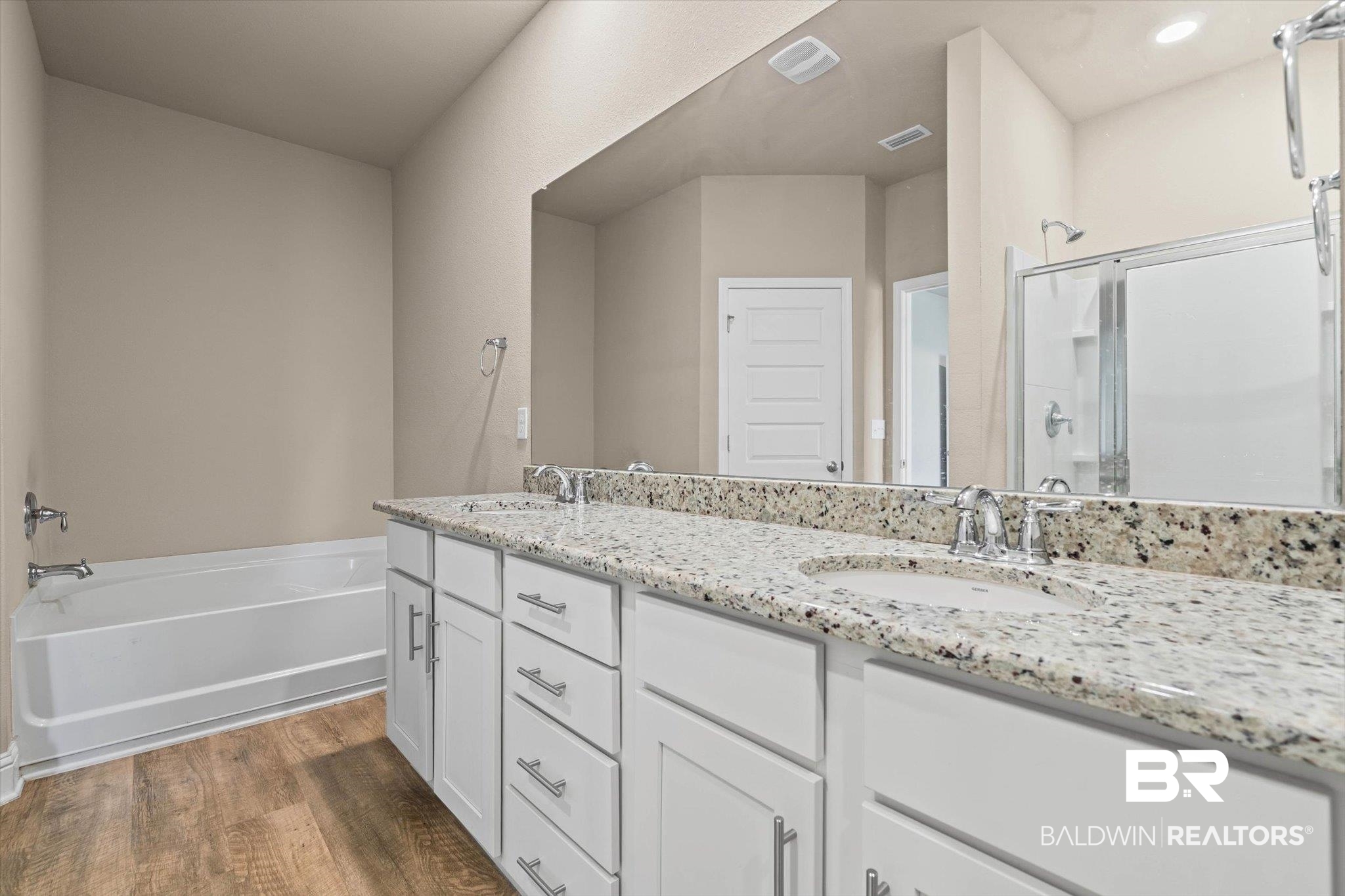 22976 Lieutenant Avenue Foley, AL 36535 - Photo 11 of 30 Full bath with a shower stall, double vanity, a bath, and dark wood finished floors