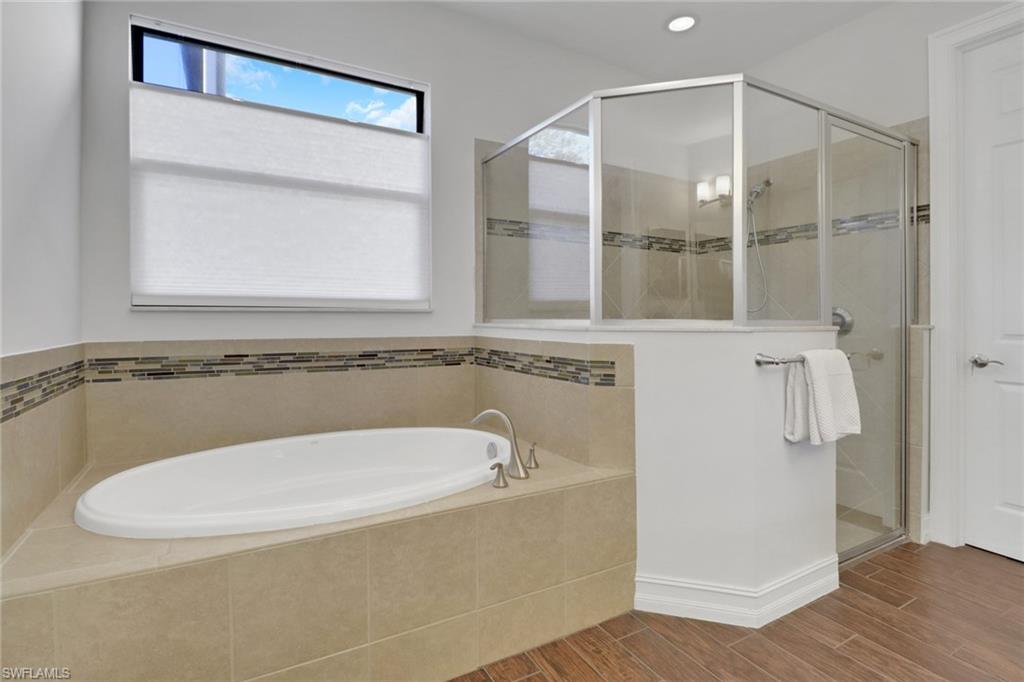 14374 Tuscany Pointe Trail Naples, FL 34120 - Photo 32 of 38 a bathroom with a granite countertop sink and a mirror