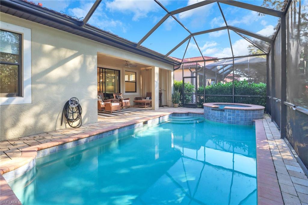 14374 Tuscany Pointe Trail Naples, FL 34120 - Photo 37 of 38 a swimming pool with outdoor seating