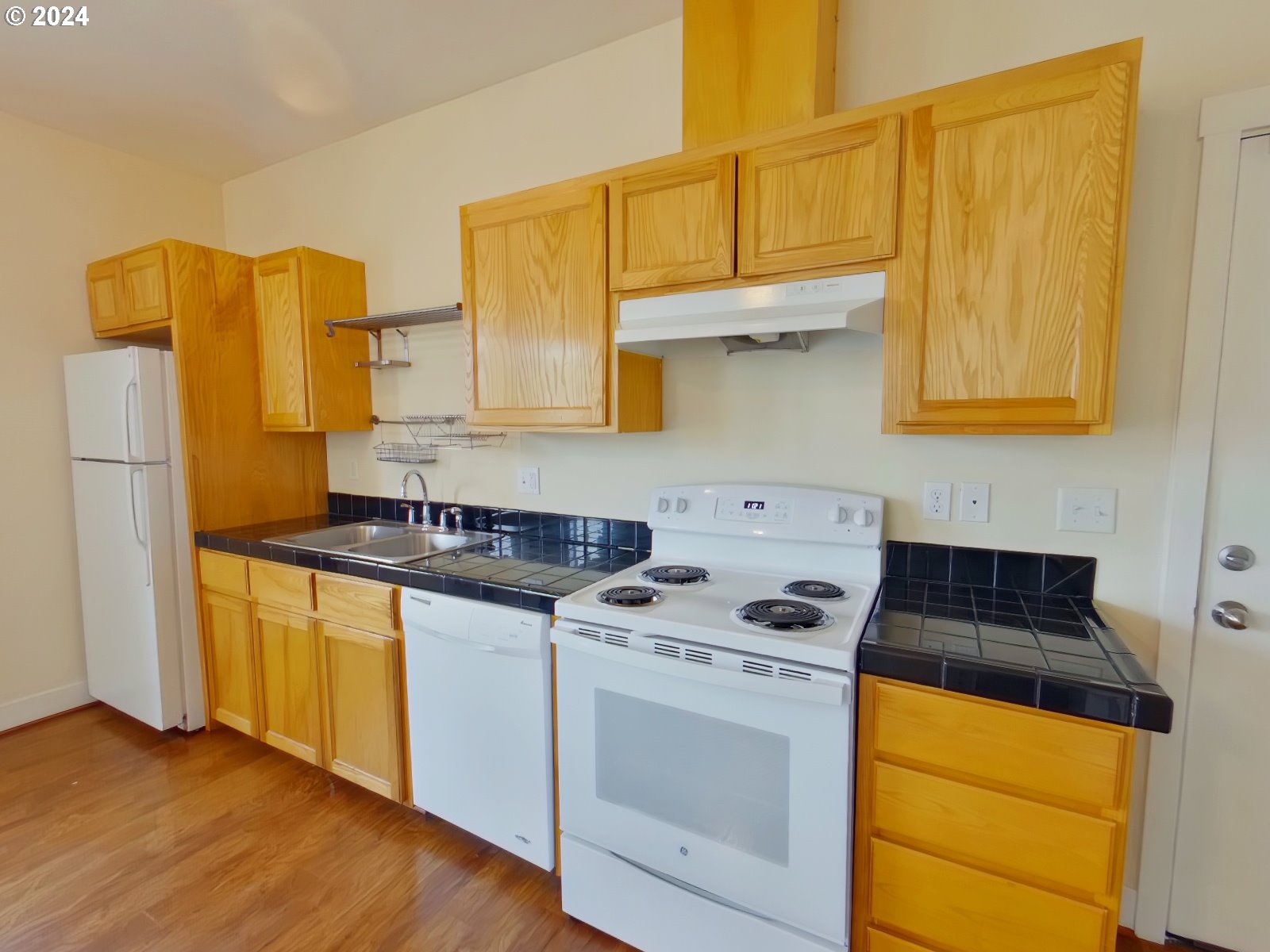 1857 Pearl Street Eugene, OR 97401 - Photo 19 of 45 a kitchen with stainless steel appliances granite countertop a stove a sink and a refrigerator
