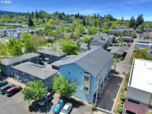 an aerial view of a house with a yard basket ball court and outdoor seating