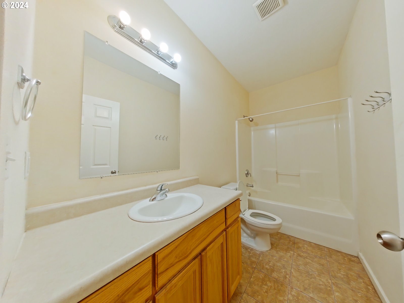 1857 Pearl Street Eugene, OR 97401 - Photo 21 of 45 a bathroom with a sink a toilet a mirror and shower