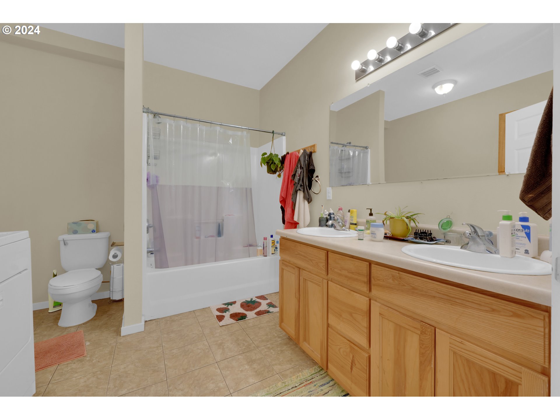 1857 Pearl Street Eugene, OR 97401 - Photo 24 of 45 a bathroom with a sink a toilet and shower
