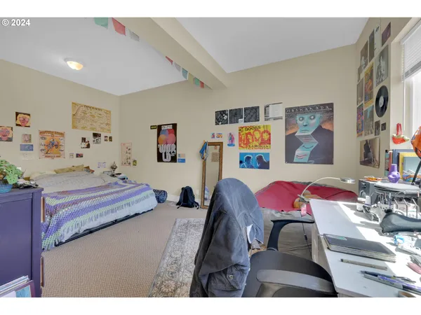 a bedroom with furniture and a bed