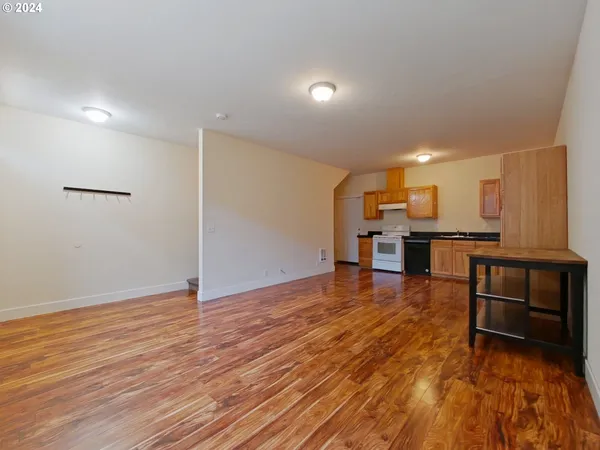 a view of kitchen with furniture and wooden floor