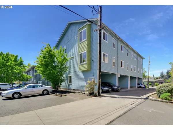 a couple of cars parked in front of a house