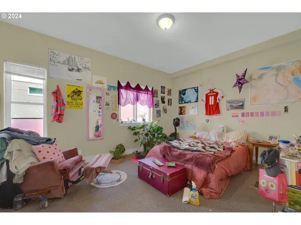 a bedroom with furniture and a bed