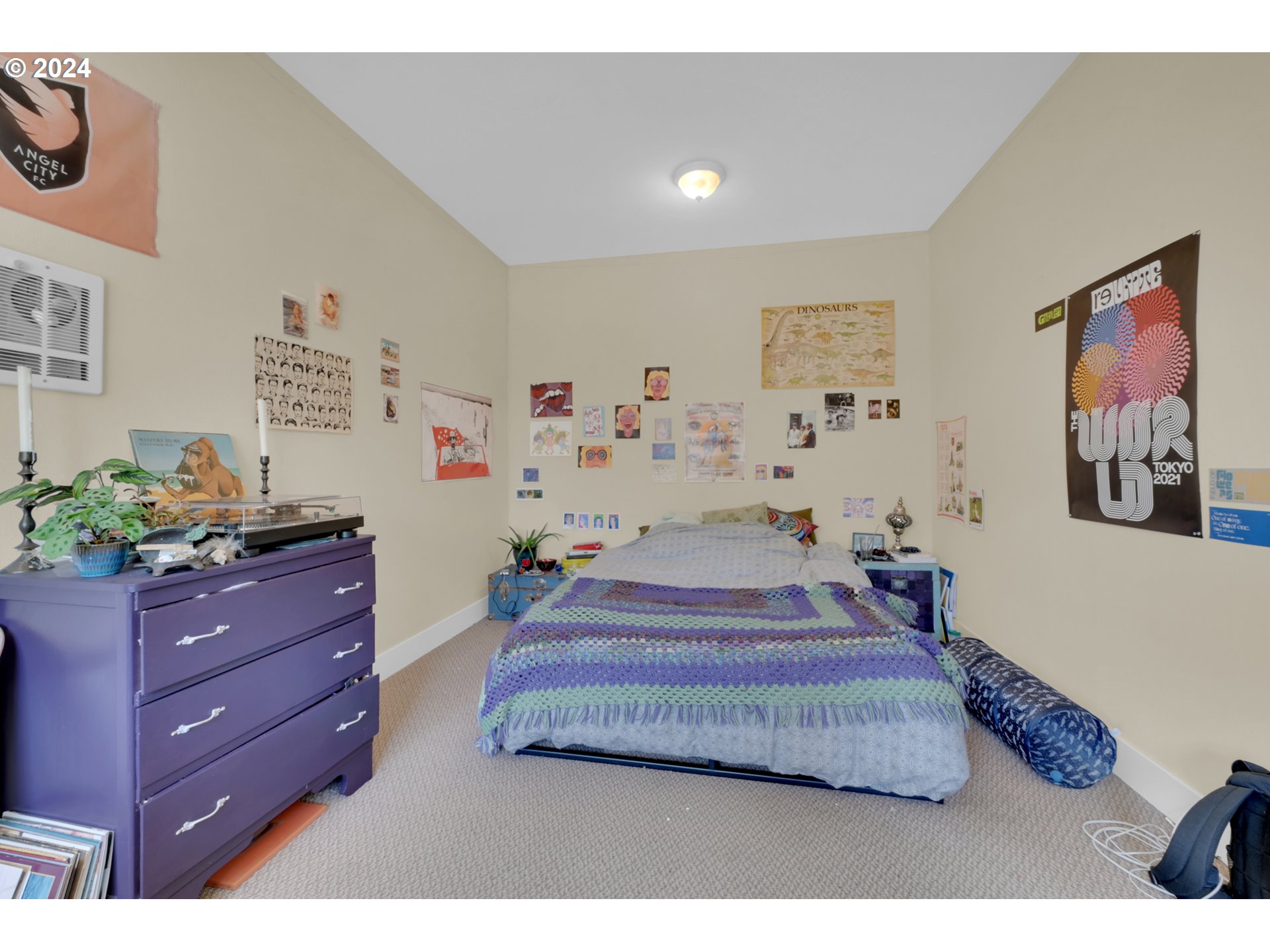 1857 Pearl Street Eugene, OR 97401 - Photo 8 of 45 a bedroom with a bed and paintings on the wall
