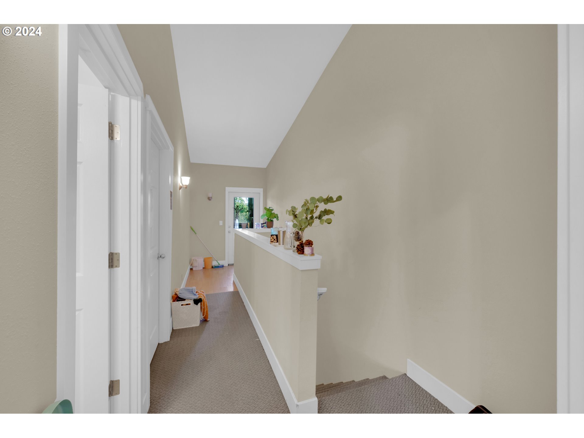 1857 Pearl Street Eugene, OR 97401 - Photo 9 of 45 a view of a hallway with white walls and stairs