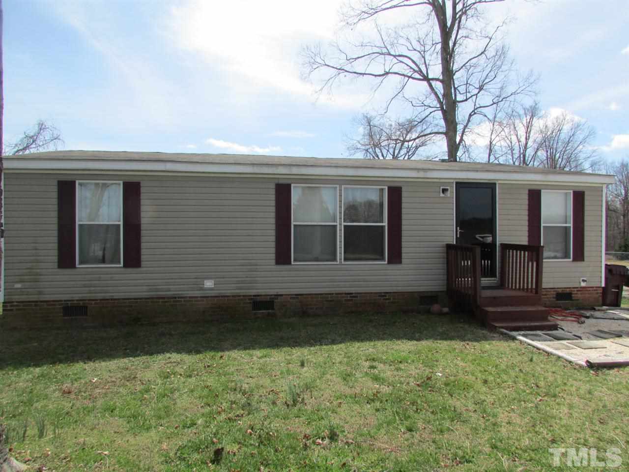 1294 Allensville Road Roxboro, NC 27574 - Photo 2 of 16 a backyard of a house with barbeque oven