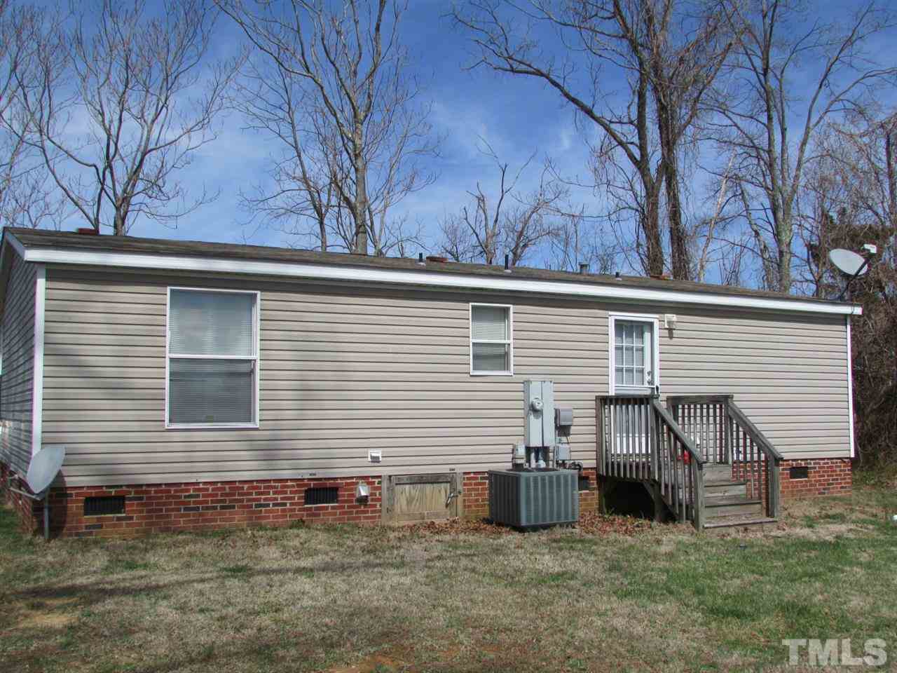 1294 Allensville Road Roxboro, NC 27574 - Photo 13 of 16 a view of a house with a back yard