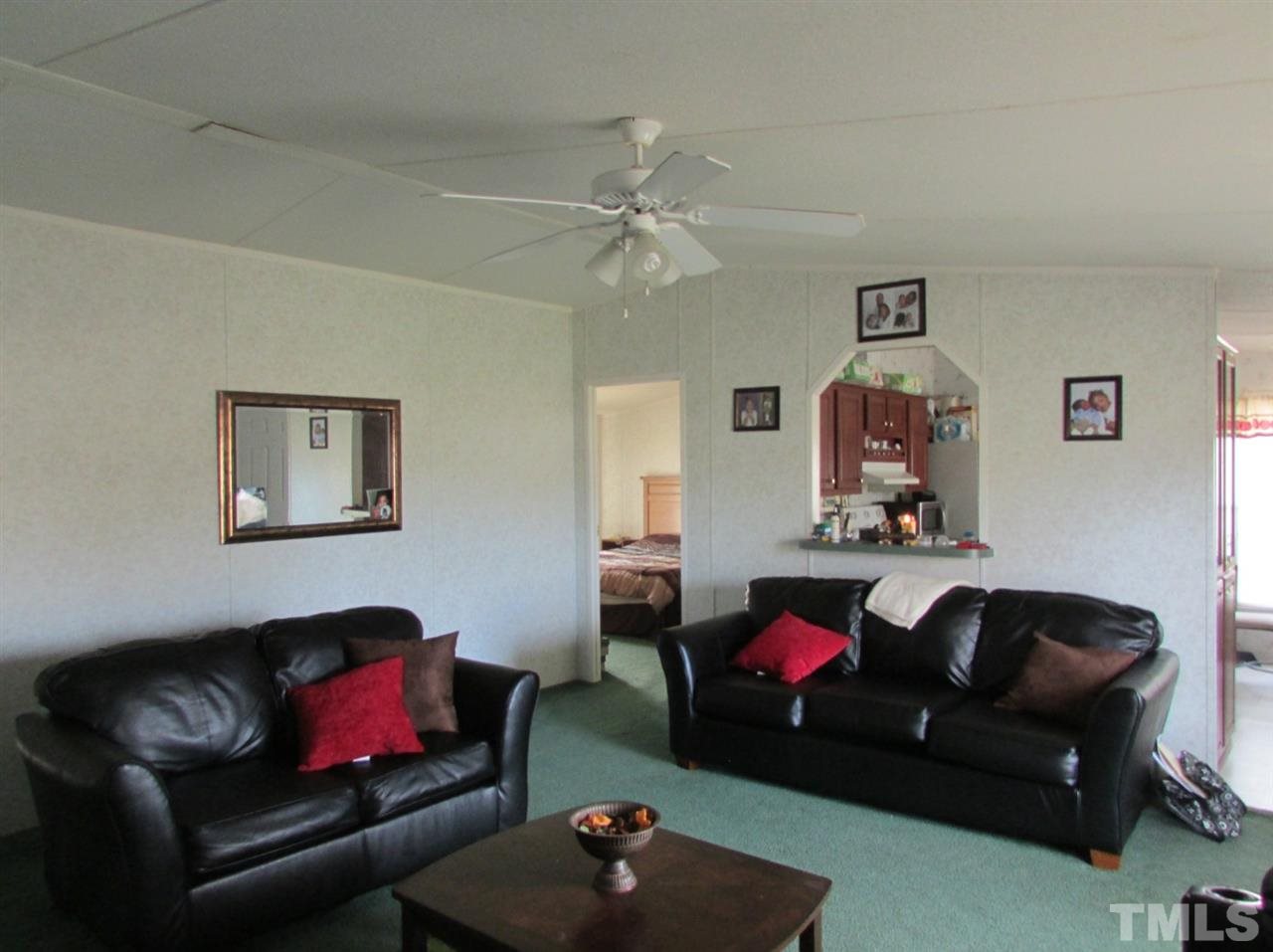 1294 Allensville Road Roxboro, NC 27574 - Photo 4 of 16 a living room with furniture and a fireplace