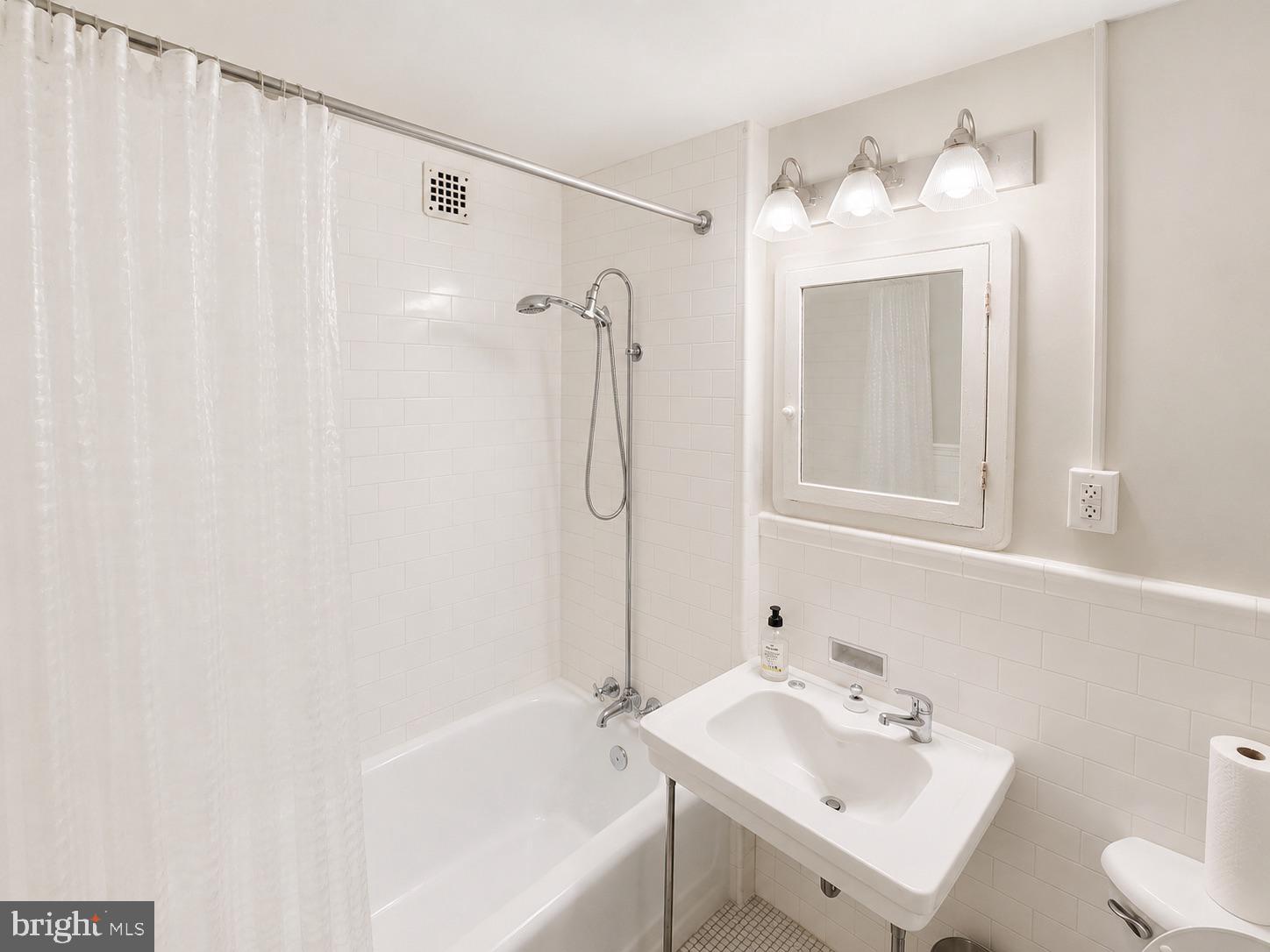 1324 Locust Street, Unit 632 Philadelphia, PA 19107 - Photo 13 of 15 Sleek and serene bathroom retreat.