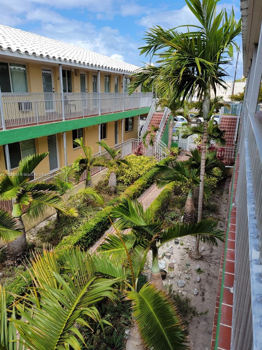 7400 Harding Avenue, Unit 15 Miami Beach, FL 33141 - Photo 1 of 29 a view of a house with a patio