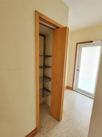 a bathroom with a toilet a sink and a mirror