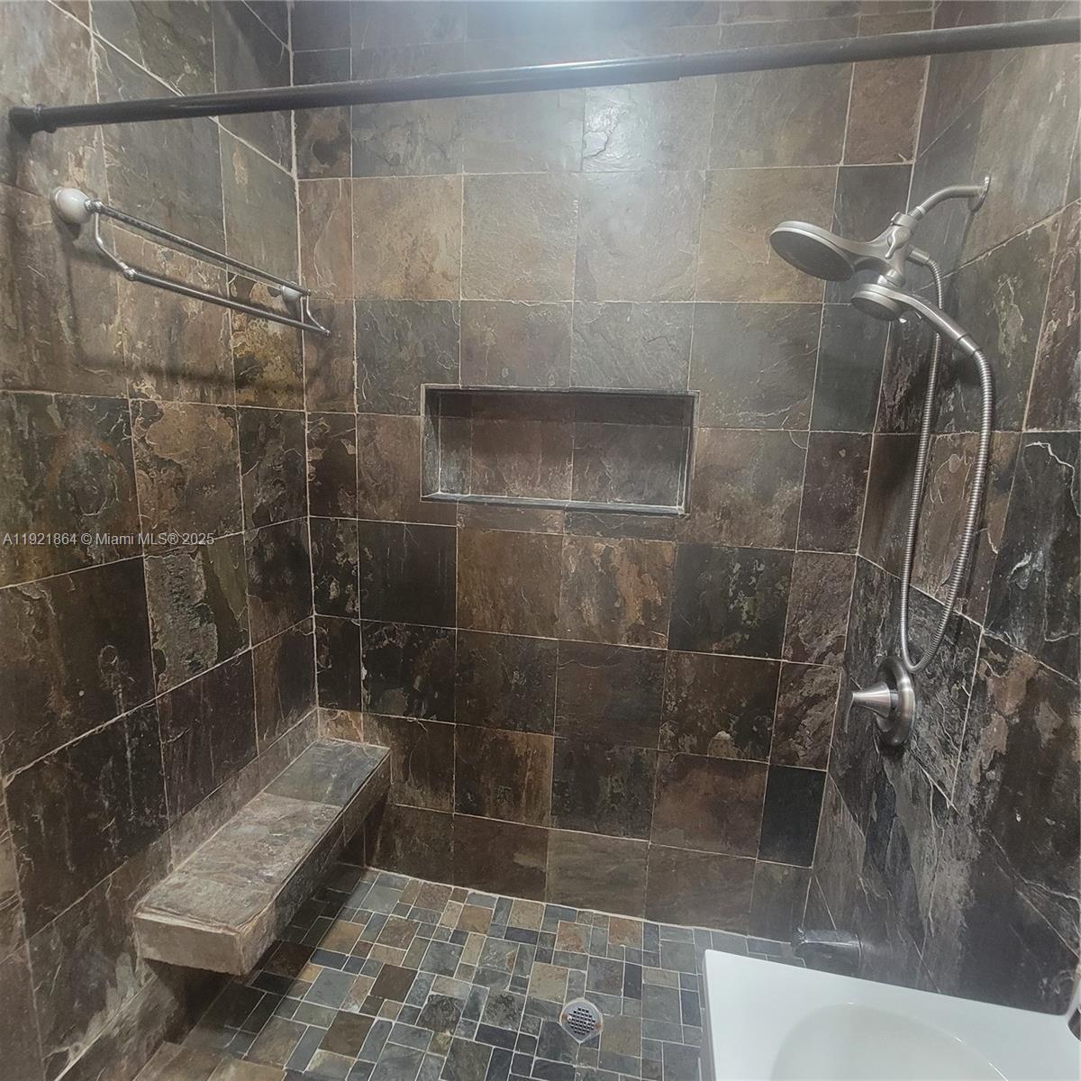 7400 Harding Avenue, Unit 15 Miami Beach, FL 33141 - Photo 20 of 29 a bathroom with a shower