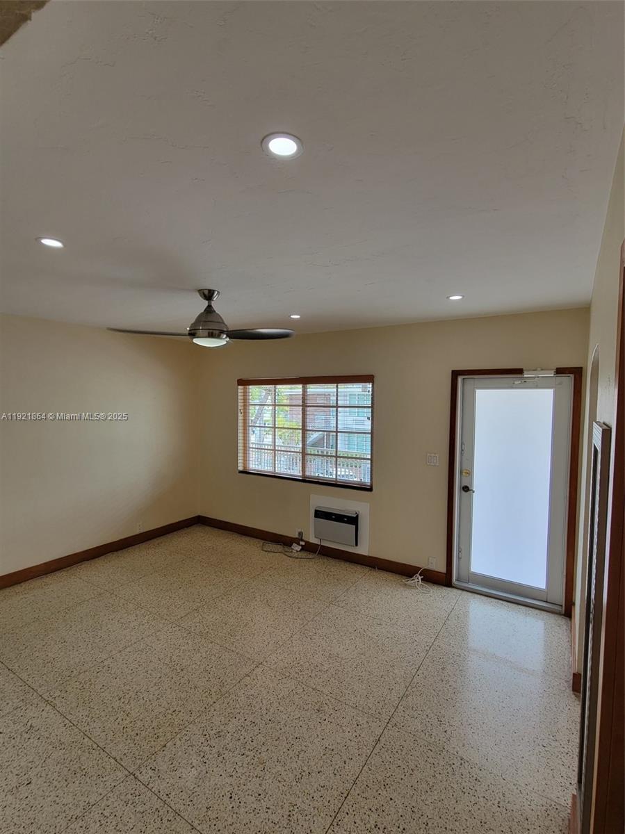7400 Harding Avenue, Unit 15 Miami Beach, FL 33141 - Photo 9 of 29 an empty room with windows and closet