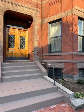 a view of a brick house with a large windows