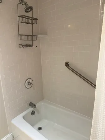a bathroom with a bath tub
