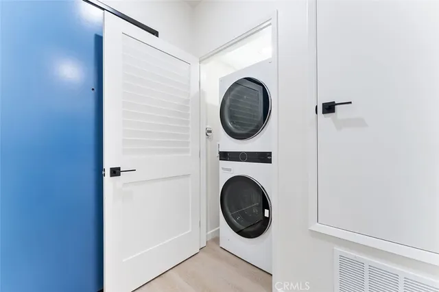 a view of a hallway with washer and dryer