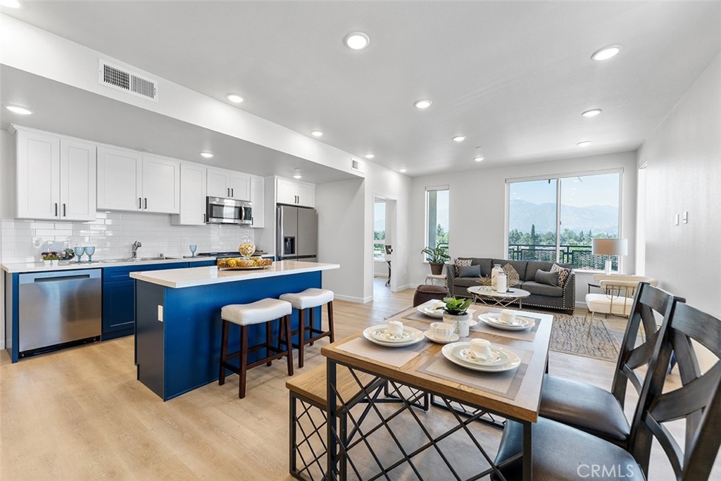 4064 Live Oak Avenue, Unit 208 Arcadia, CA 91006 - Photo 21 of 50 a view of a dining room with furniture a kitchen and chandelier