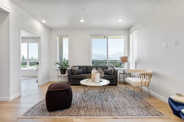 a living room with furniture and a rug