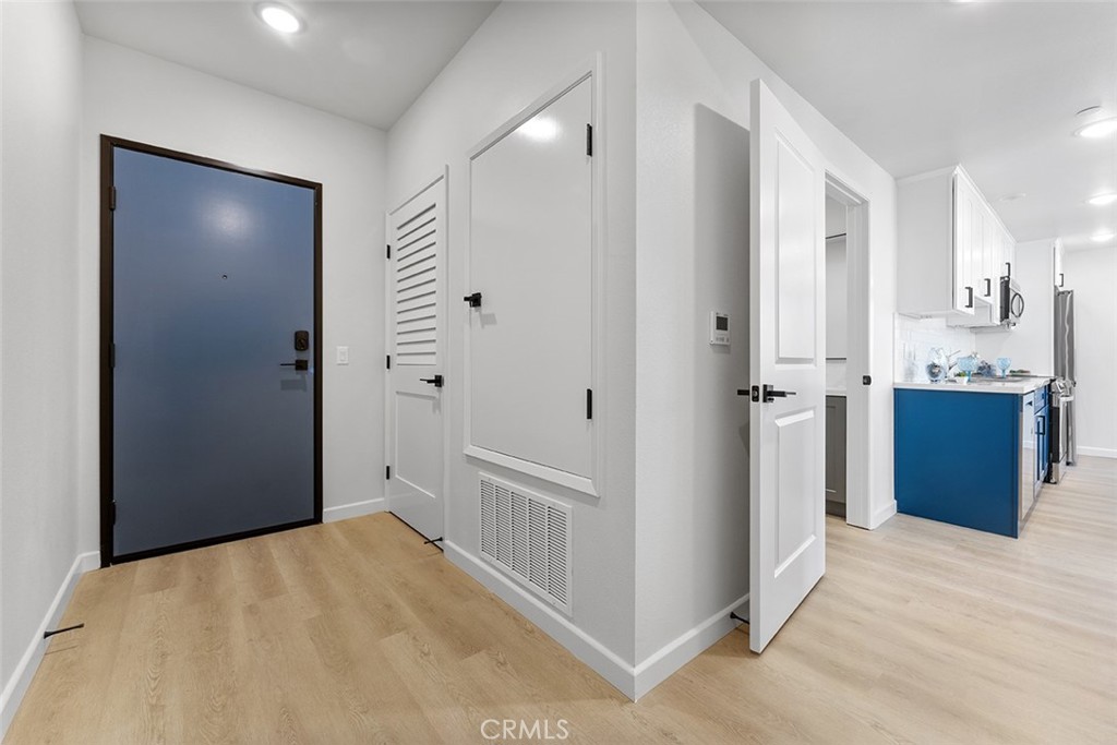 4064 Live Oak Avenue, Unit 208 Arcadia, CA 91006 - Photo 27 of 50 a view of a hallway with wooden floor and cabinet
