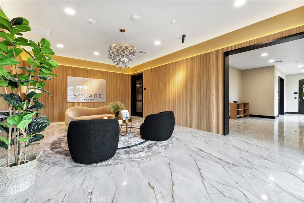 4064 Live Oak Avenue, Unit 208 Arcadia, CA 91006 - Photo 31 of 50 a living room with furniture potted plant and a chandelier