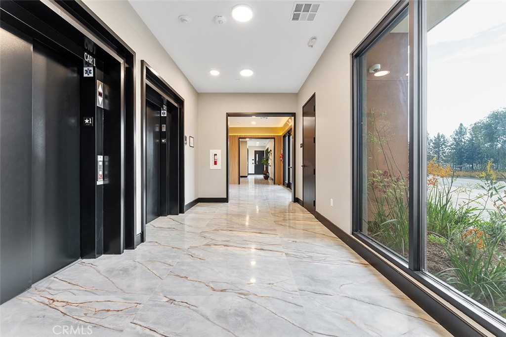 4064 Live Oak Avenue, Unit 208 Arcadia, CA 91006 - Photo 36 of 50 a view of a hallway with wooden floor and a bathroom